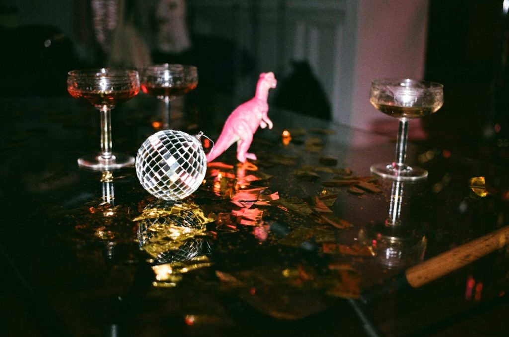Half finished drinks and a mirrorball and pink dinosaur tell of the nights before gay depression